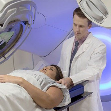 therapist readying patient for scan