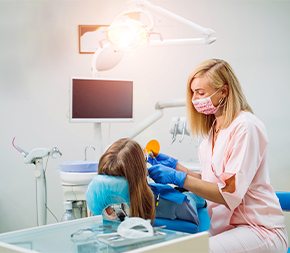woman dental assistant x-rays patient teeth